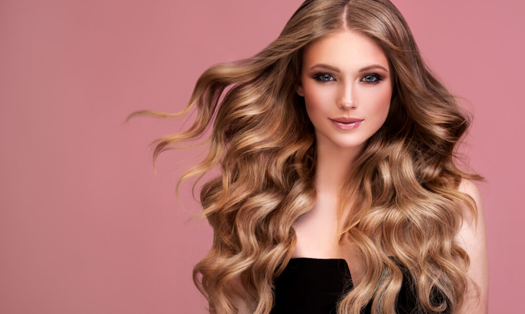 A model with voluminous and smooth blowout hairstyle, styled at The Blowup Bar in Houston, Texas, a premier destination for professional beauty services
